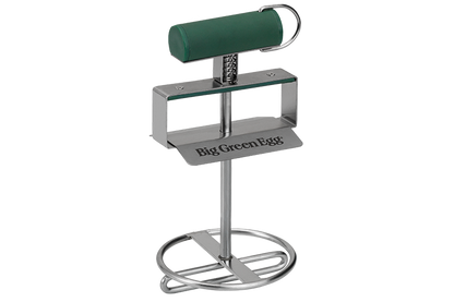 De roosterlifter van Big GreenEgg met groen handvat.